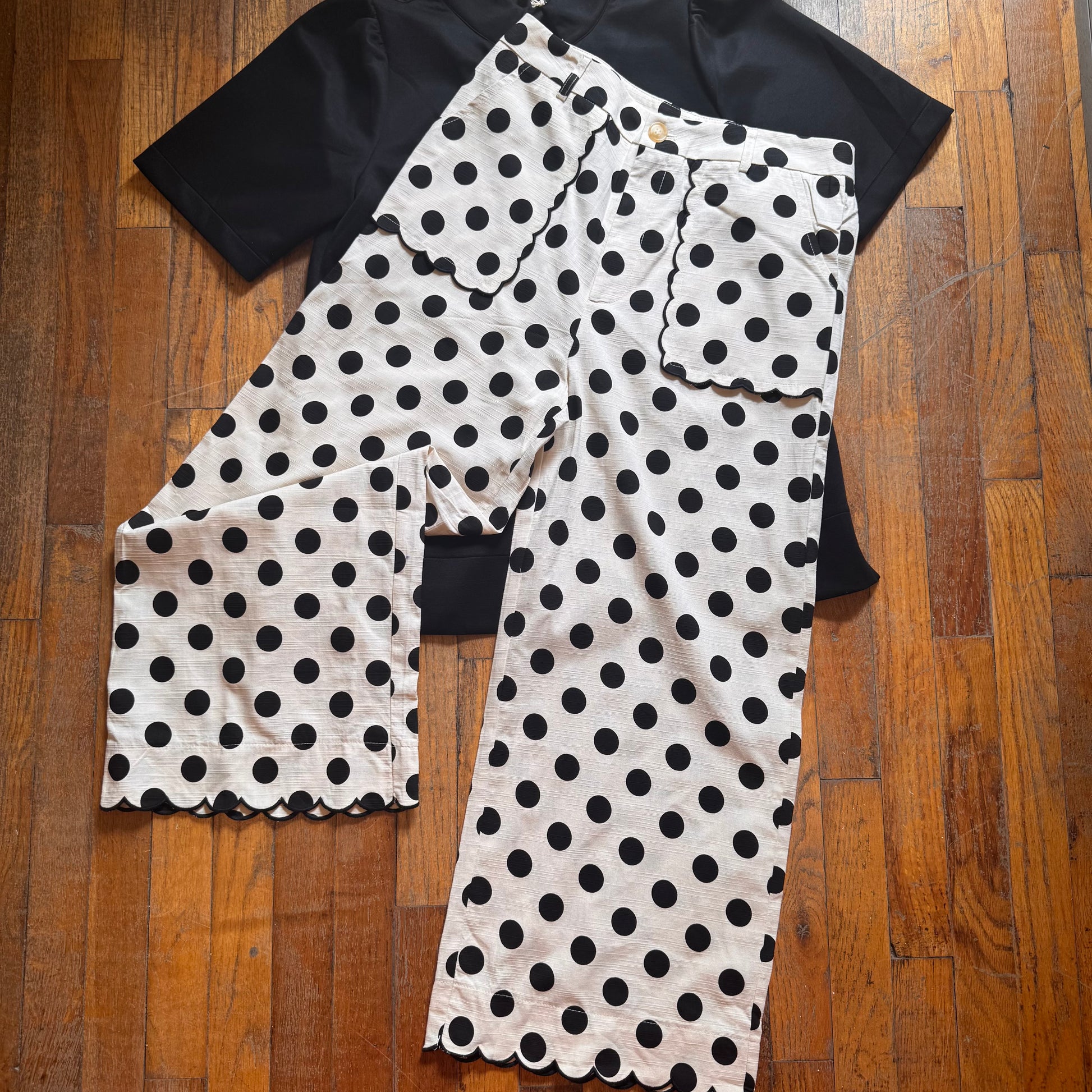 Polka dot pants on a wooden floor